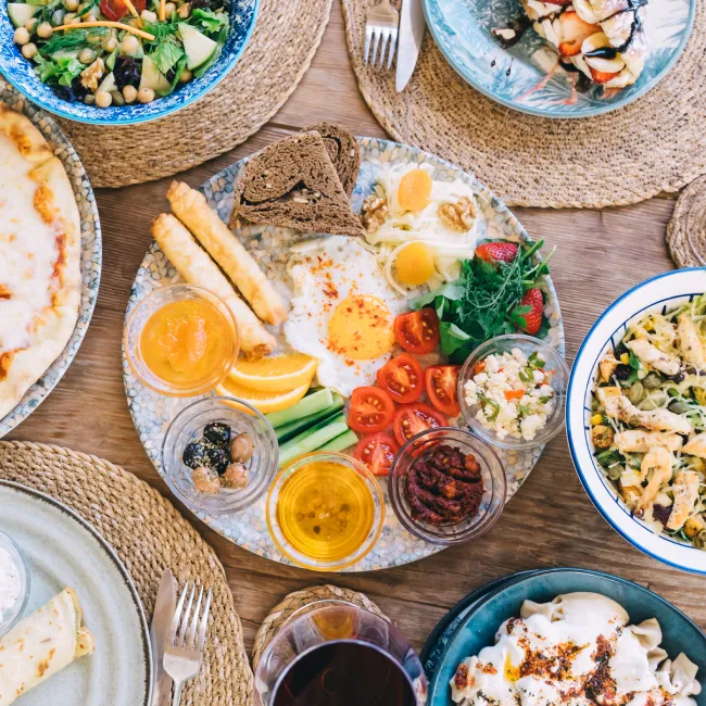 photo of a Turkish breakfast on wooden table top view.