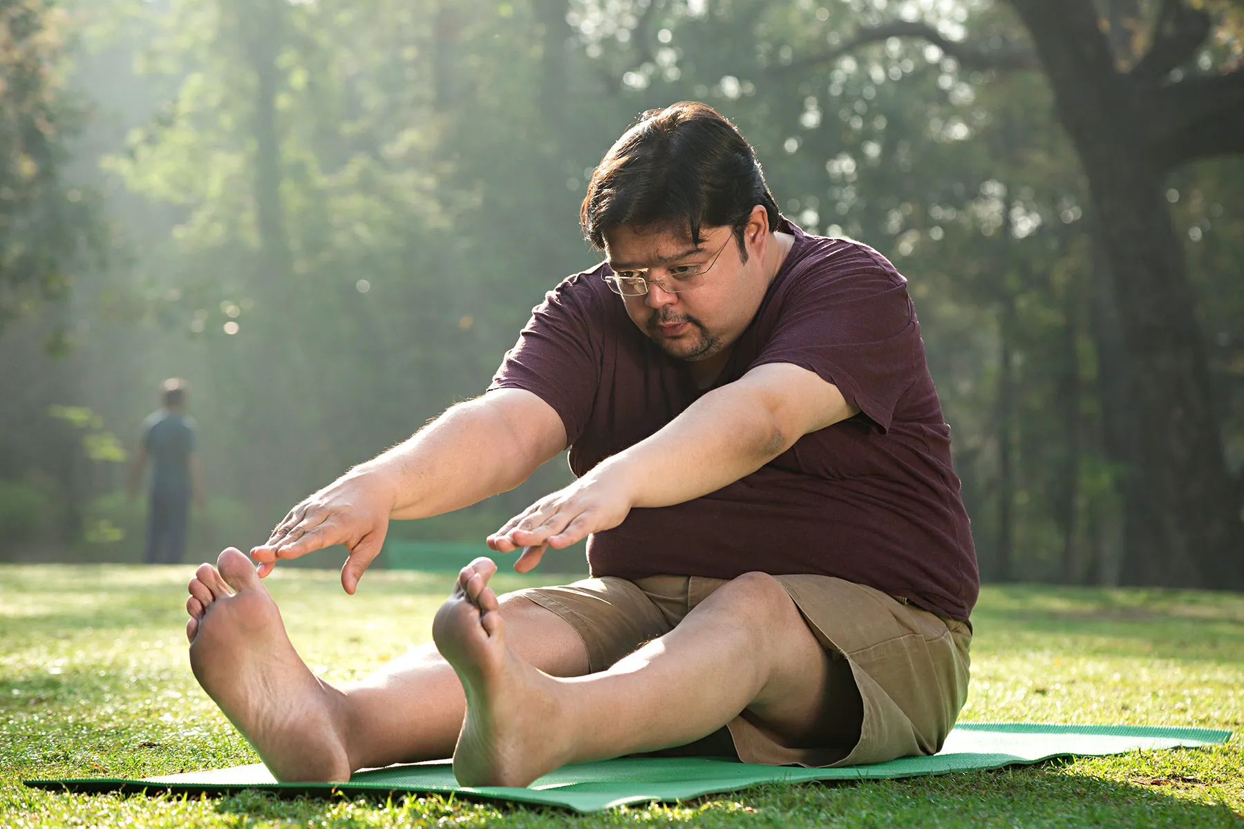 photo of a man stretching in park