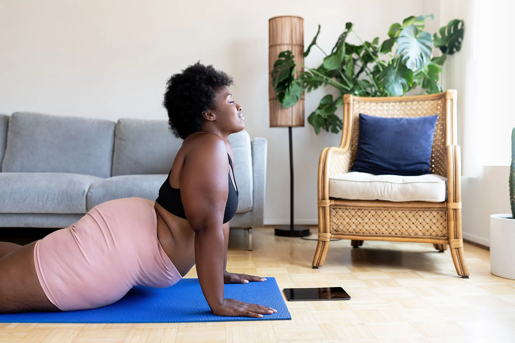 photo of s woman doing yoga at home