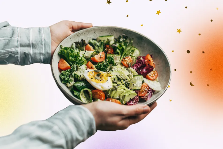 photo of hands holding a superfood salad