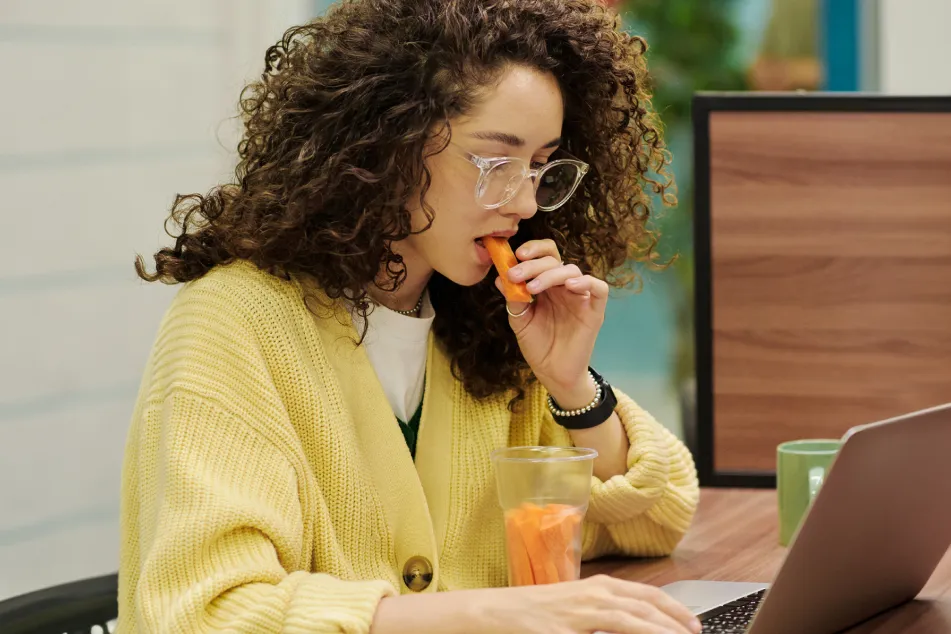 photo of a smiling man wearing colorful outfit in studio