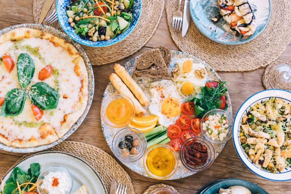 photo of a Turkish breakfast on wooden table top view.