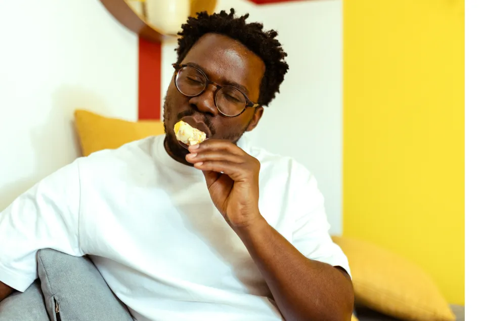 photo of a young black man eating ice cream