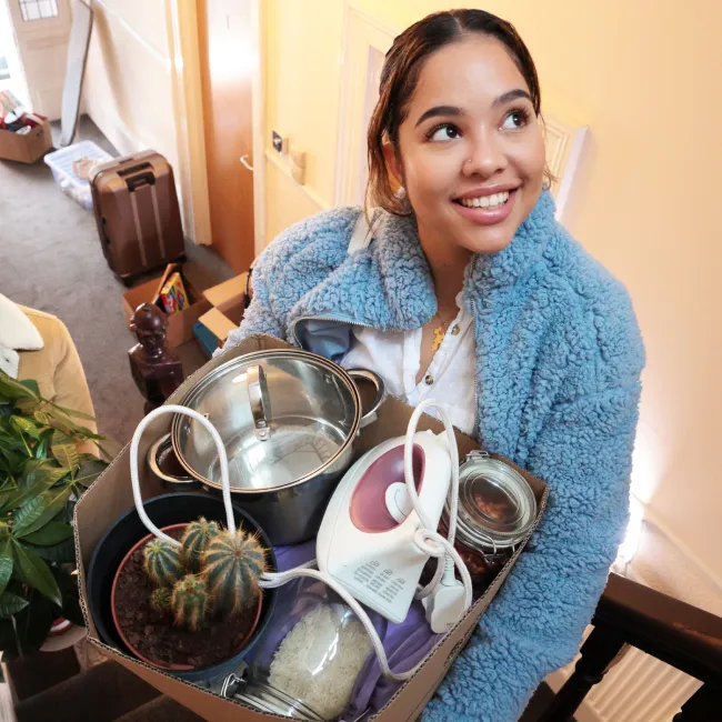 photo of two women moving into an apartment