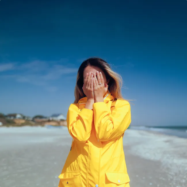 photo of woman covering her face