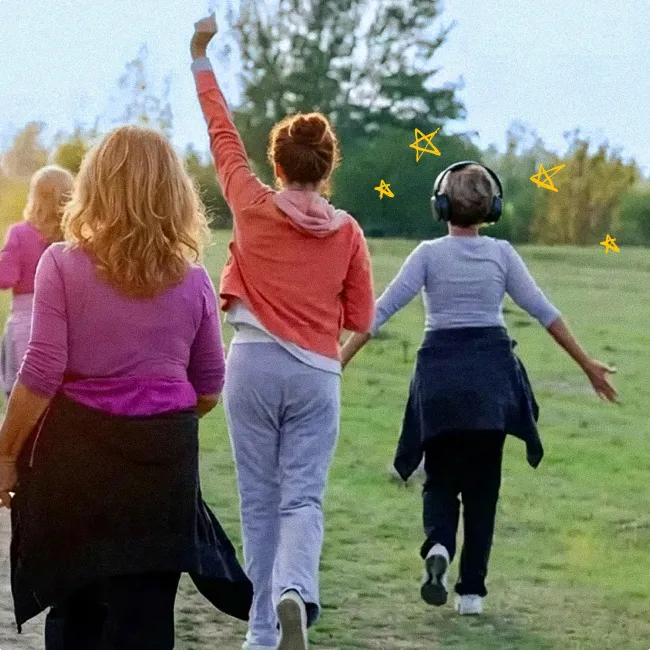 photo of female friends over fifty exercising outdoors