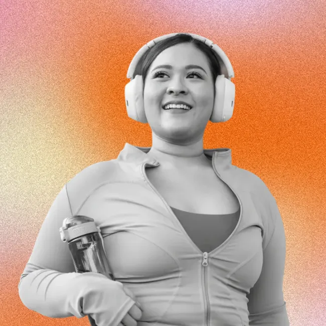 photo of a young woman wearing headphones and exercising