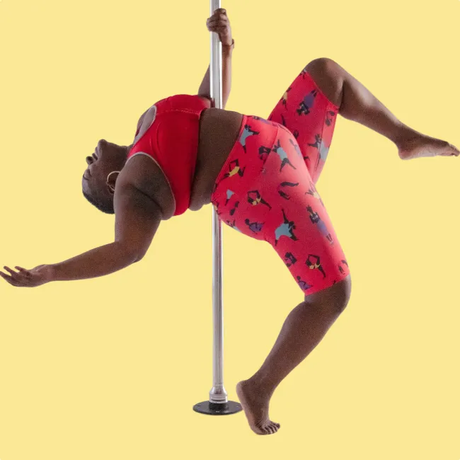 photo of Roz Mays doing pole dance exercise