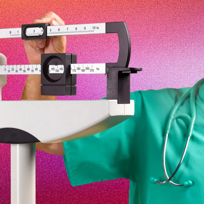 photo of a doctor's hand adjusting a medical scales
