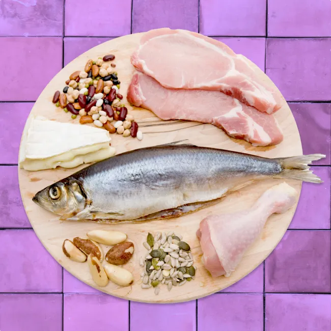 photo of a protein food group over purple tile background