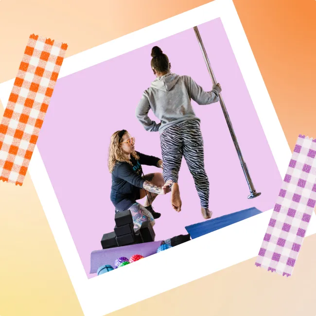 photo of a pole dancing instructor giving assistance