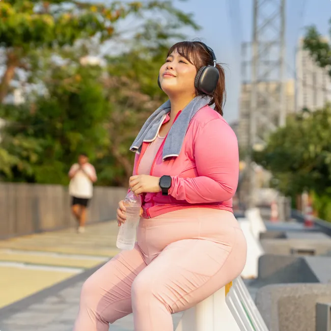 photo of a plus size woman resting after city exercise