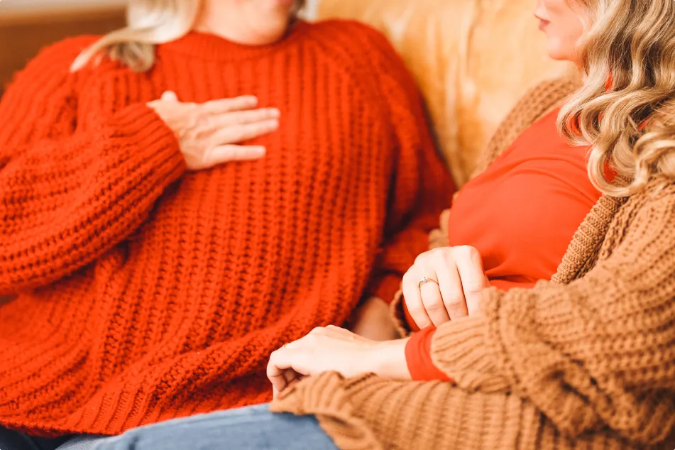 photo of women dressed in warm sweaters