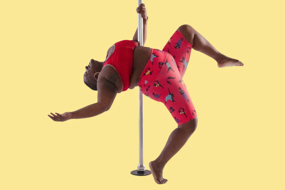 photo of Roz Mays doing pole dance exercise