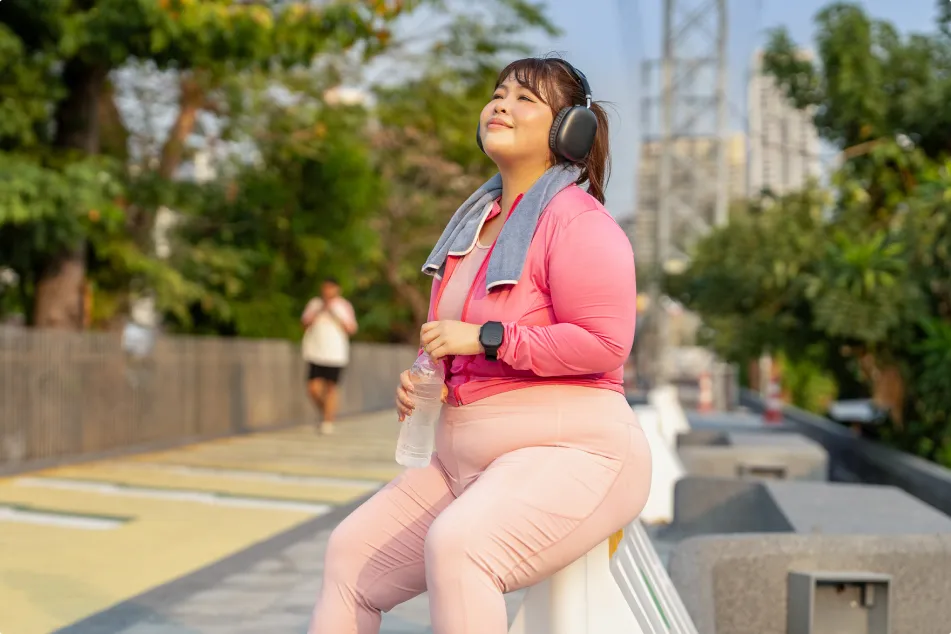 photo of a plus size woman resting after city exercise