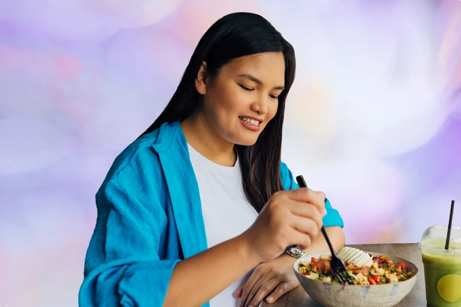 photo of a beautiful Asian woman seated enjoying her meal