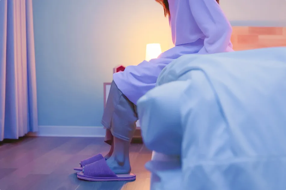 photo of a woman waking up at night to use the bathroom