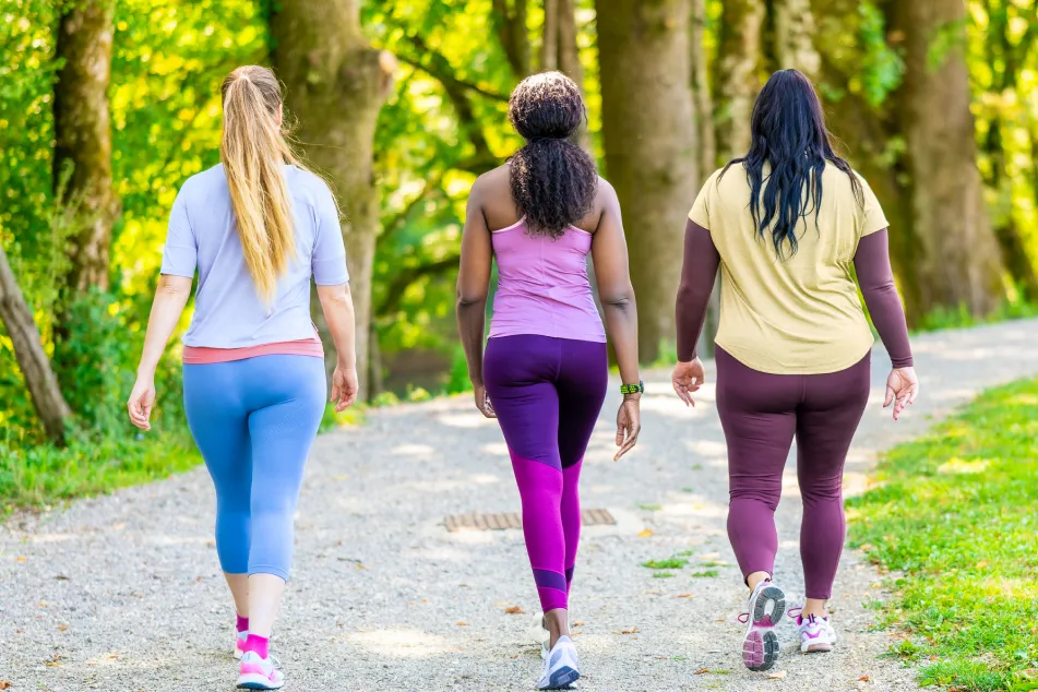 photo of women in sportswear walking 