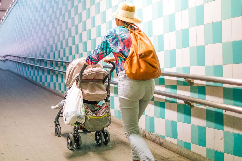 photo of Mother and son waiting for train