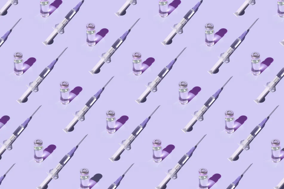 photo of a pattern of vials and syringes with a vaccine on a purple background