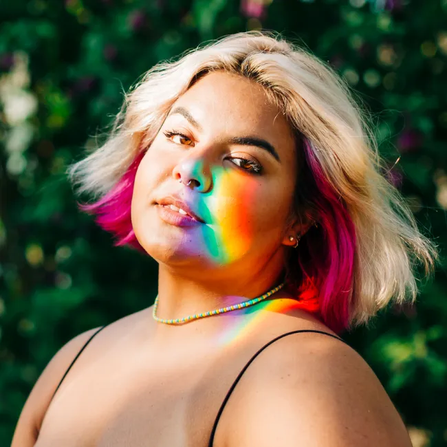 photo of a teenager with yellow and pink hair