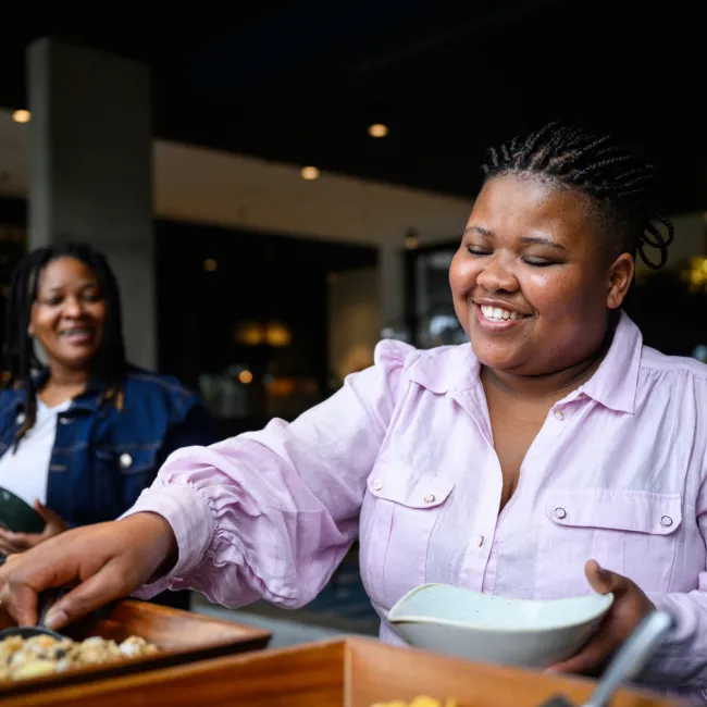 photo of serving food from buffet trays