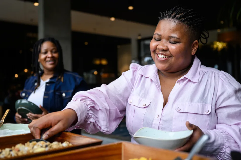 photo of serving food from buffet trays