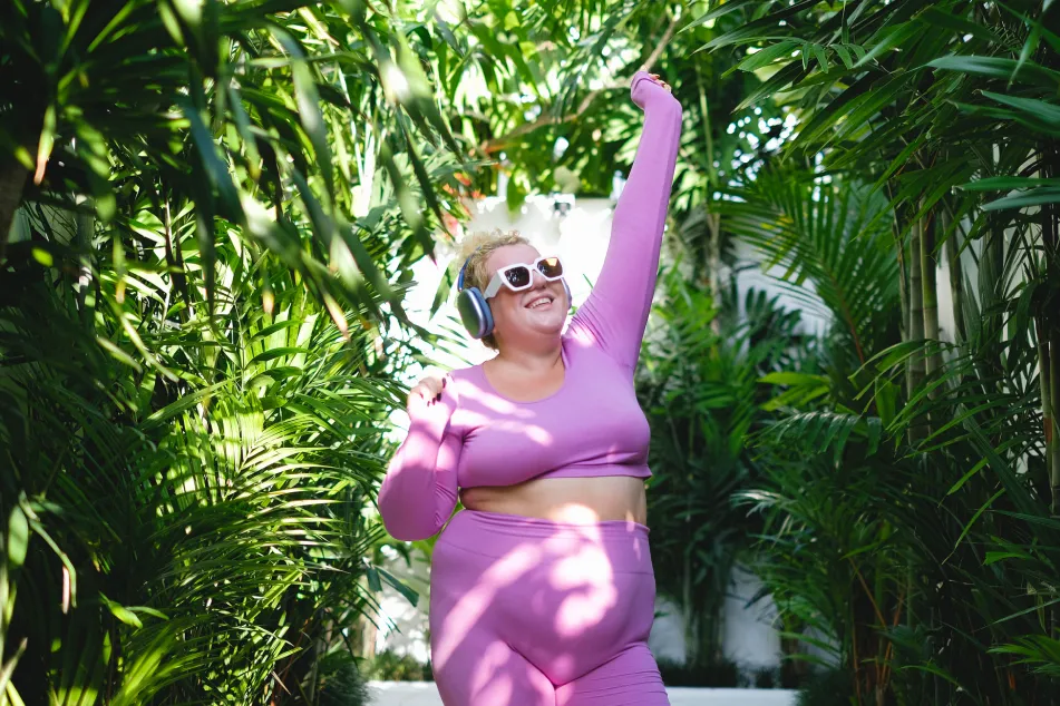 photo of overweight woman dancing outdoors