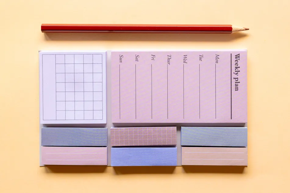 photo of Weekly planner with colored sticky 