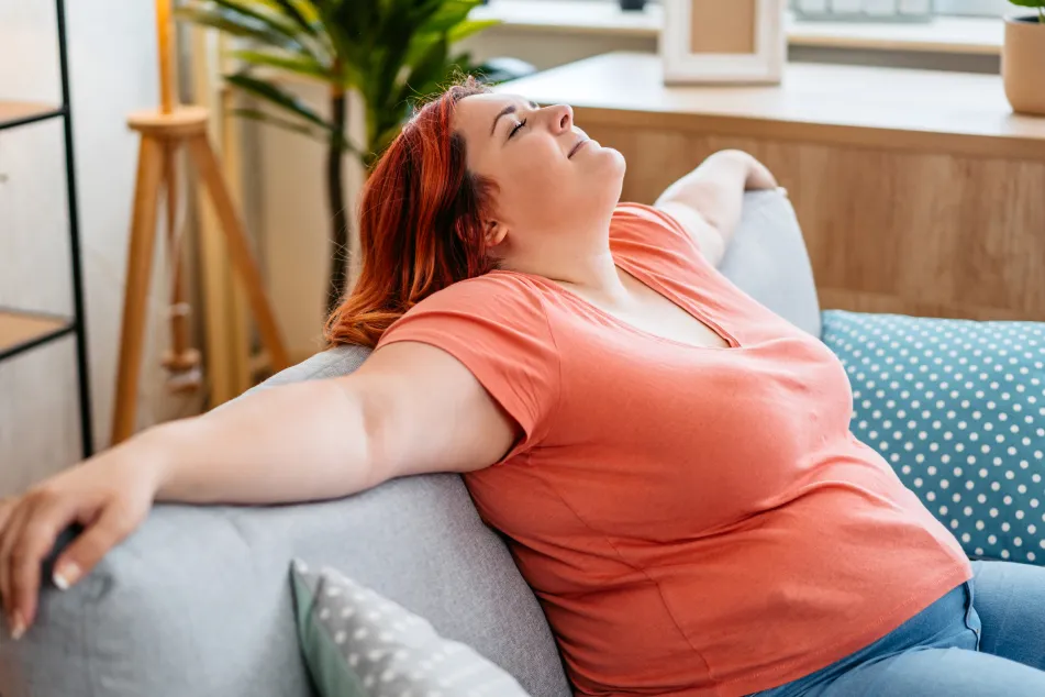 photo of woman lying on the sofa