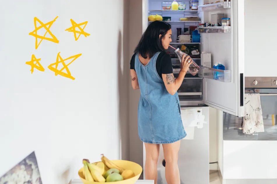 photo of woman with open fridge