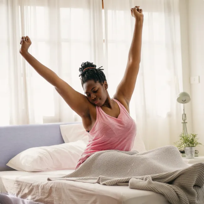 photo of woman awakens and stretches