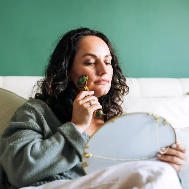 photo of woman practicing skincare 