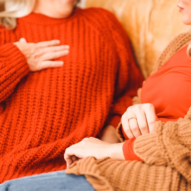 photo of women dressed in warm sweaters 