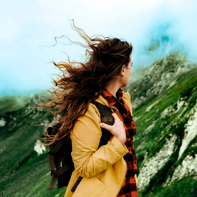 photo of girl looking at the mountain