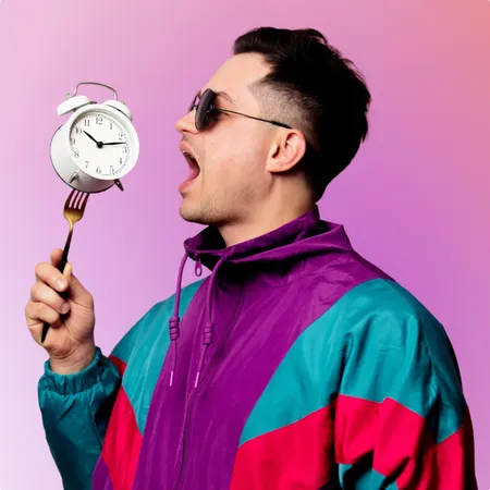 photo of guy with alarm clock on fork 