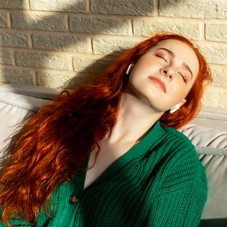 photo of Girl enjoys listening music