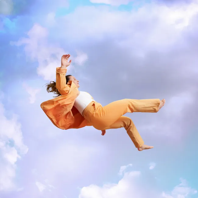 photo of woman jumping mid air