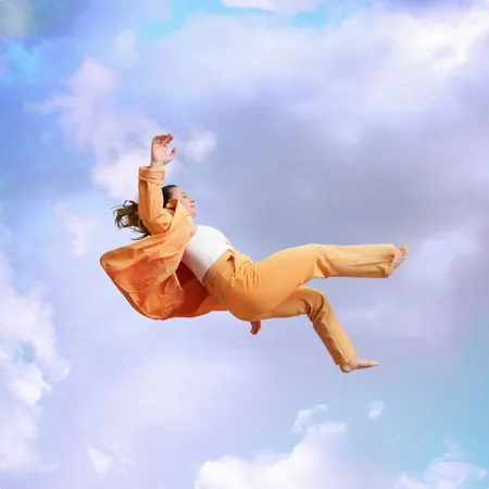 photo of woman jumping mid air