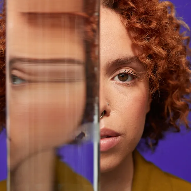 photo of distorted reflection of woman