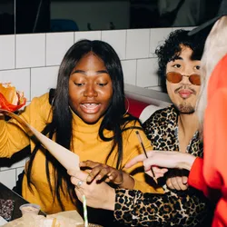 photo of woman with burger ordering food