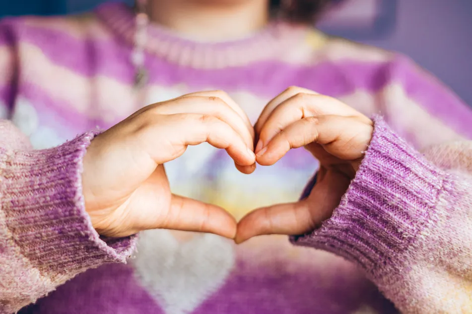 photo of heart and hands of woman for care