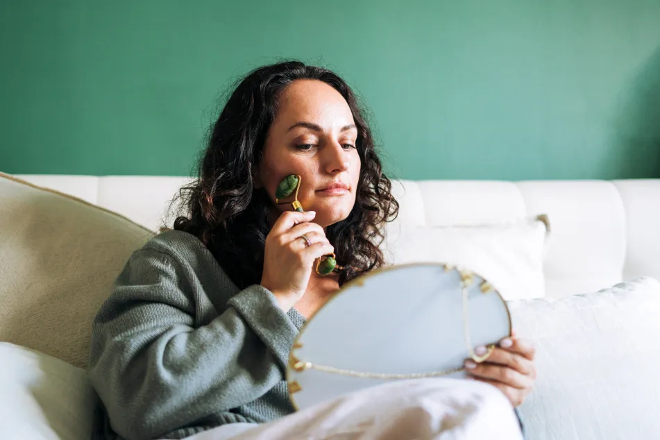 photo of woman practicing skincare 