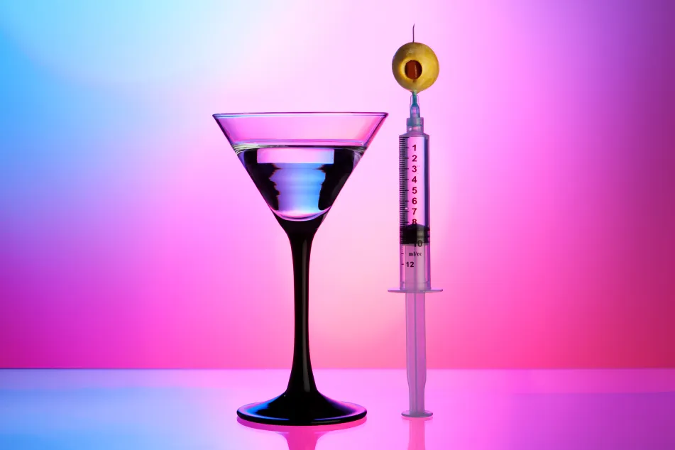 photo of Syringe, olive, and cocktail 