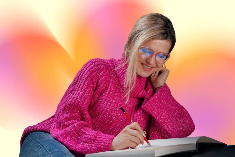 photo of woman writing in diary