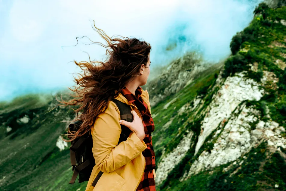 photo of girl looking at the mountain