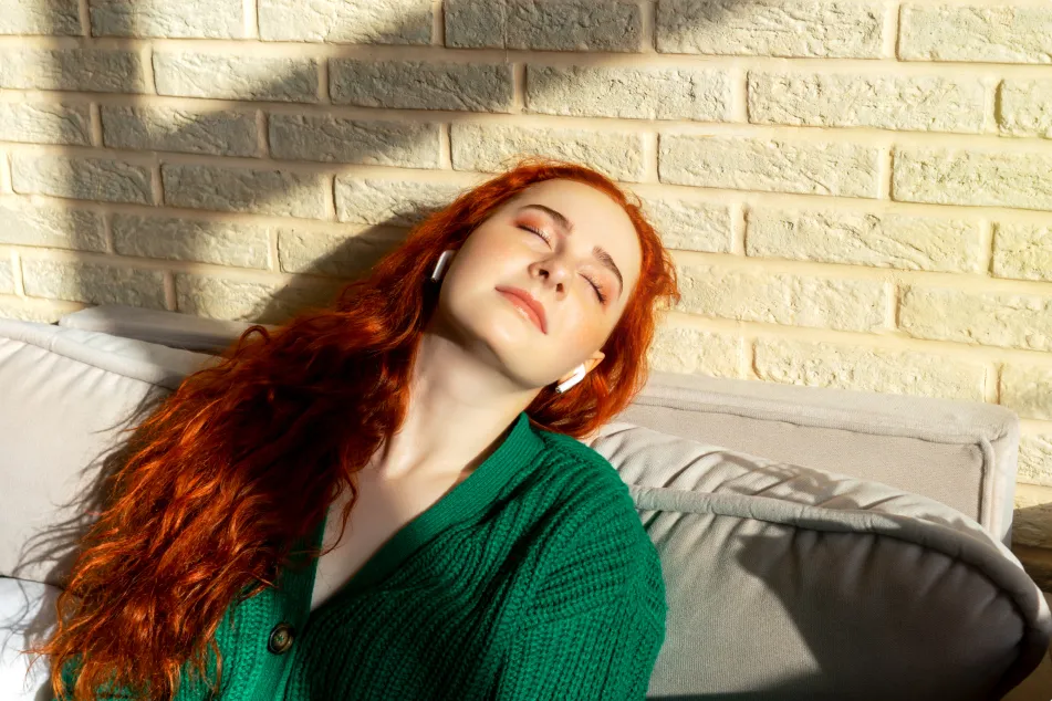 photo of Girl enjoys listening music