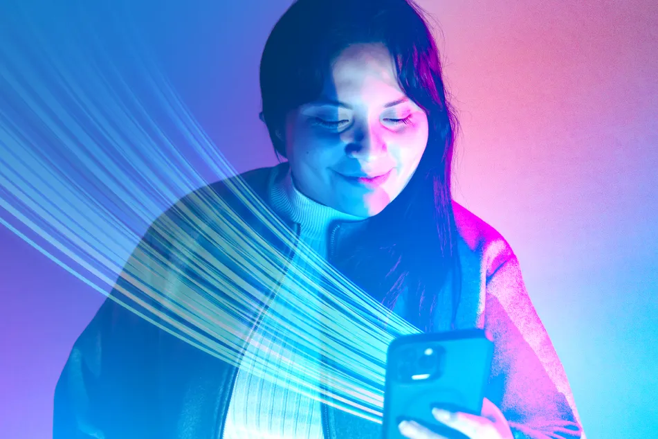 photo of woman illuminated by vibrant blue lighting