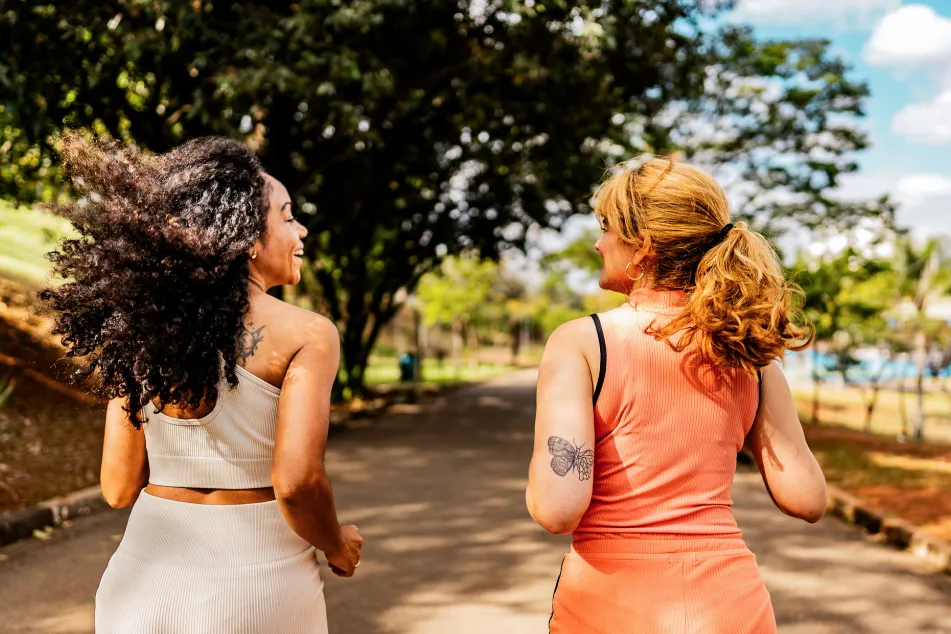 photo of women running on public park 
