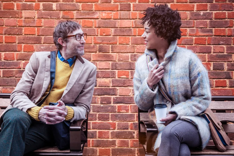 photo of talking on park bench